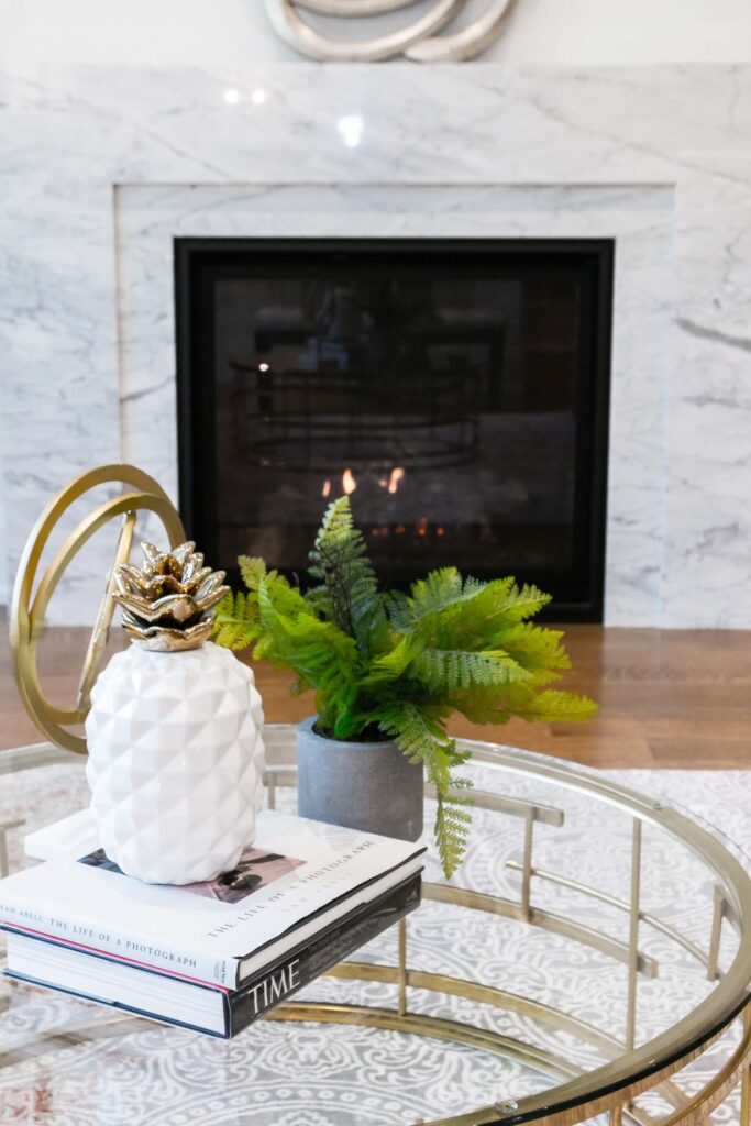 Luxury living room with marble fireplace and modern décor by Qarnis Development in Toronto.